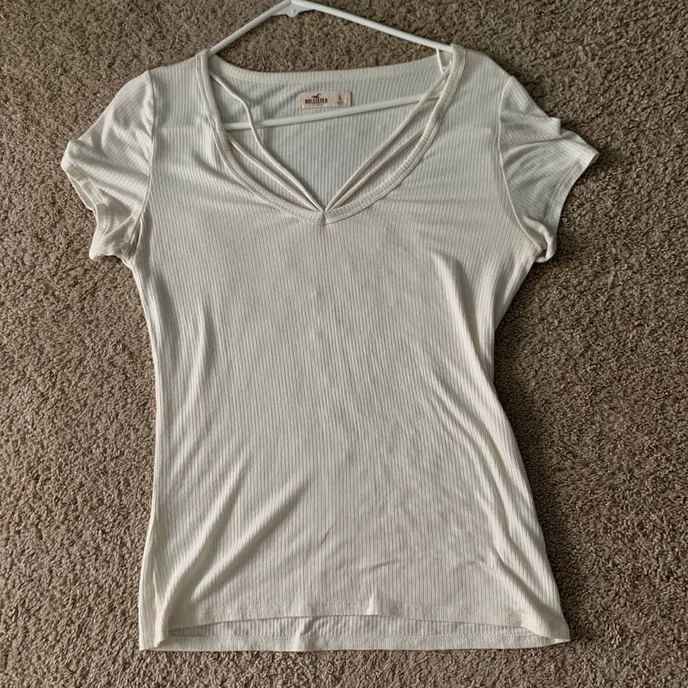 white tee shirt with cross string in front